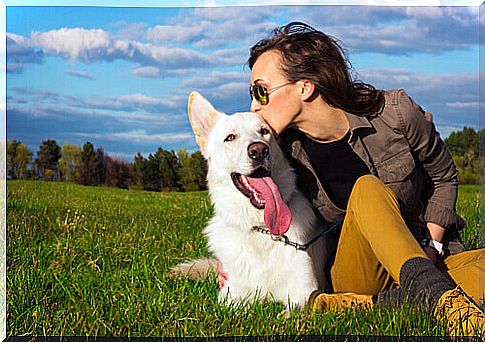 owner kissing dog